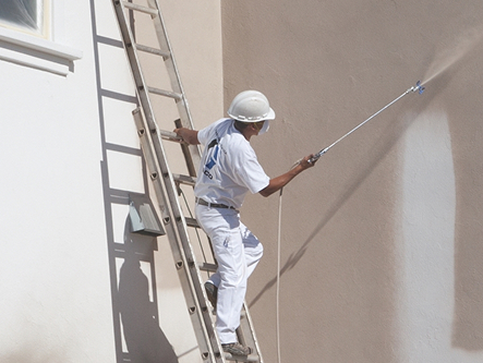 Exterior painting of a hotel and commercial building in Trichy
